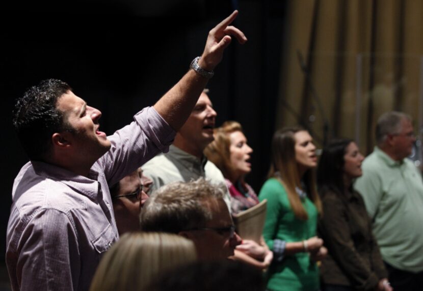 Jonathan Pokluda, left, Director of Young Adults at Watermark Community Church and over 100...