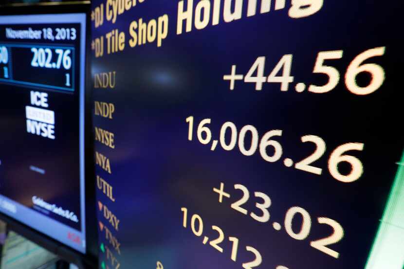 A board on the floor of the New York Stock Exchange shows the Dow Jones industrial average...