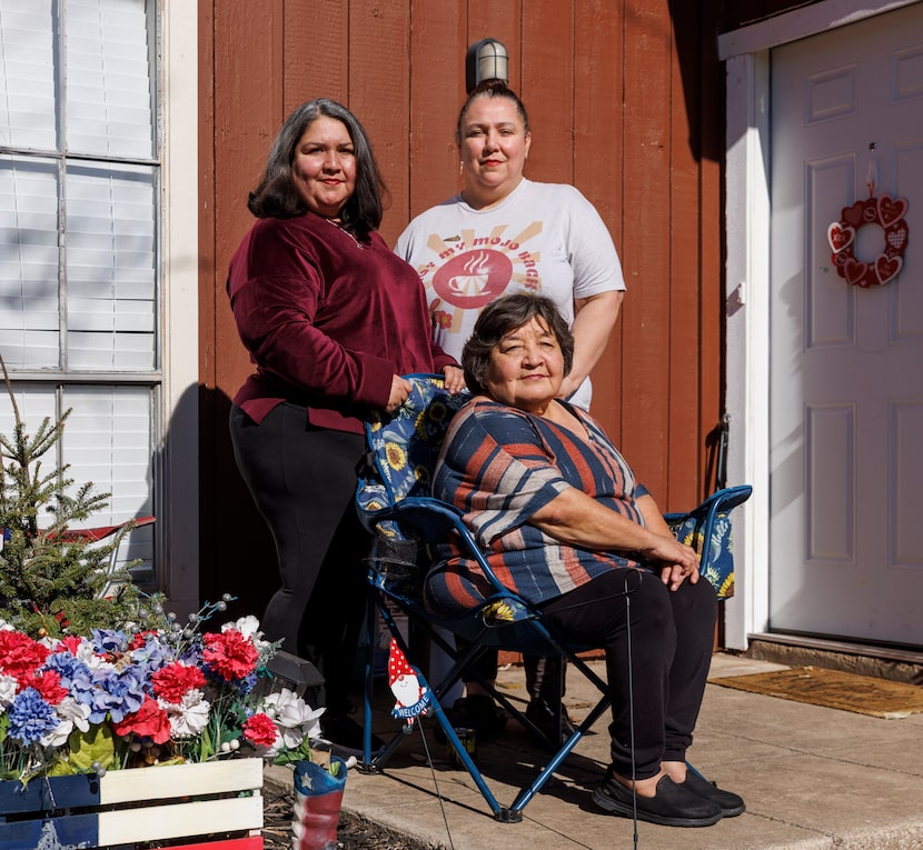 Phyllis Lopez sits with her sister Yolie Aguirre (right) and daughter Melissa Adame outside...