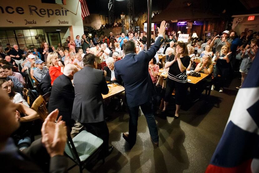 Sen. Ted Cruz waves to the crowd after addressing supporters during a campaign event at...