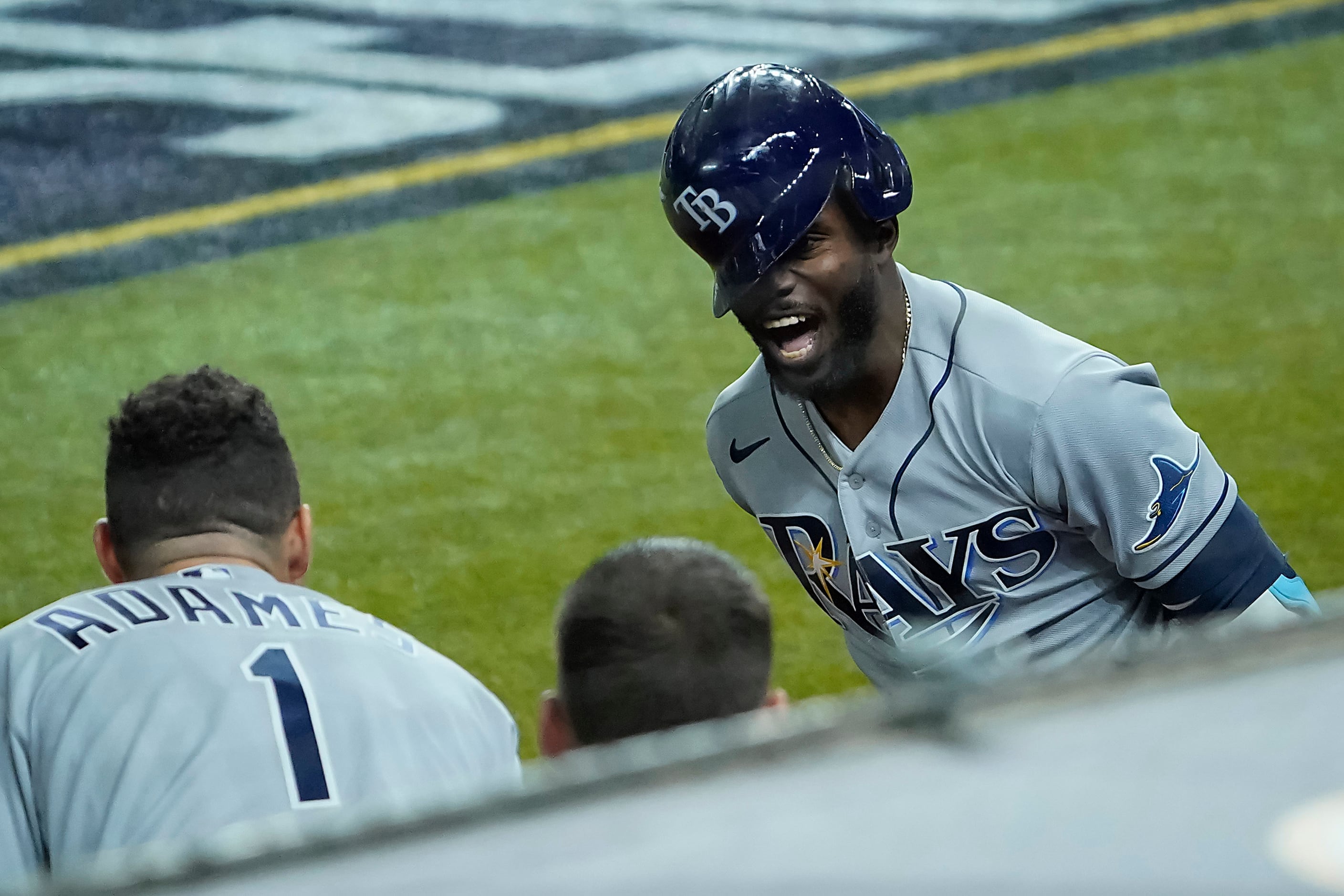 Tampa Bay Rays left fielder Randy Arozarena celebrates with shortstop Willy Adames after...