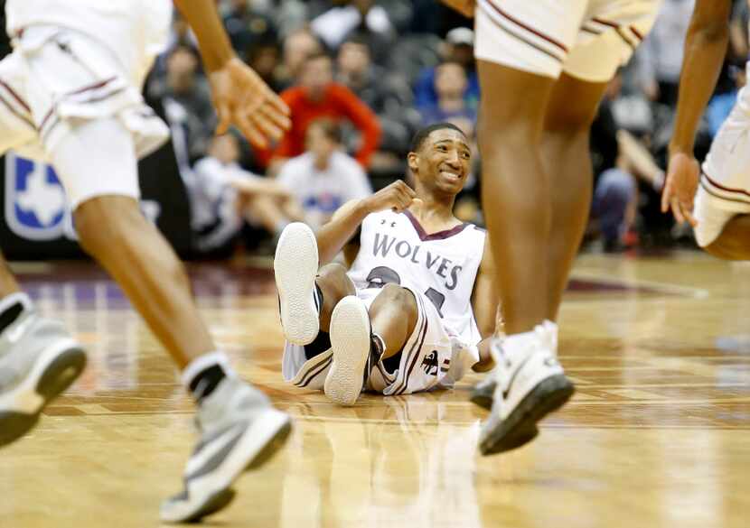 Mansfield Timberview's Chris Mullins (24) celebrates as his team rushes onto the court after...