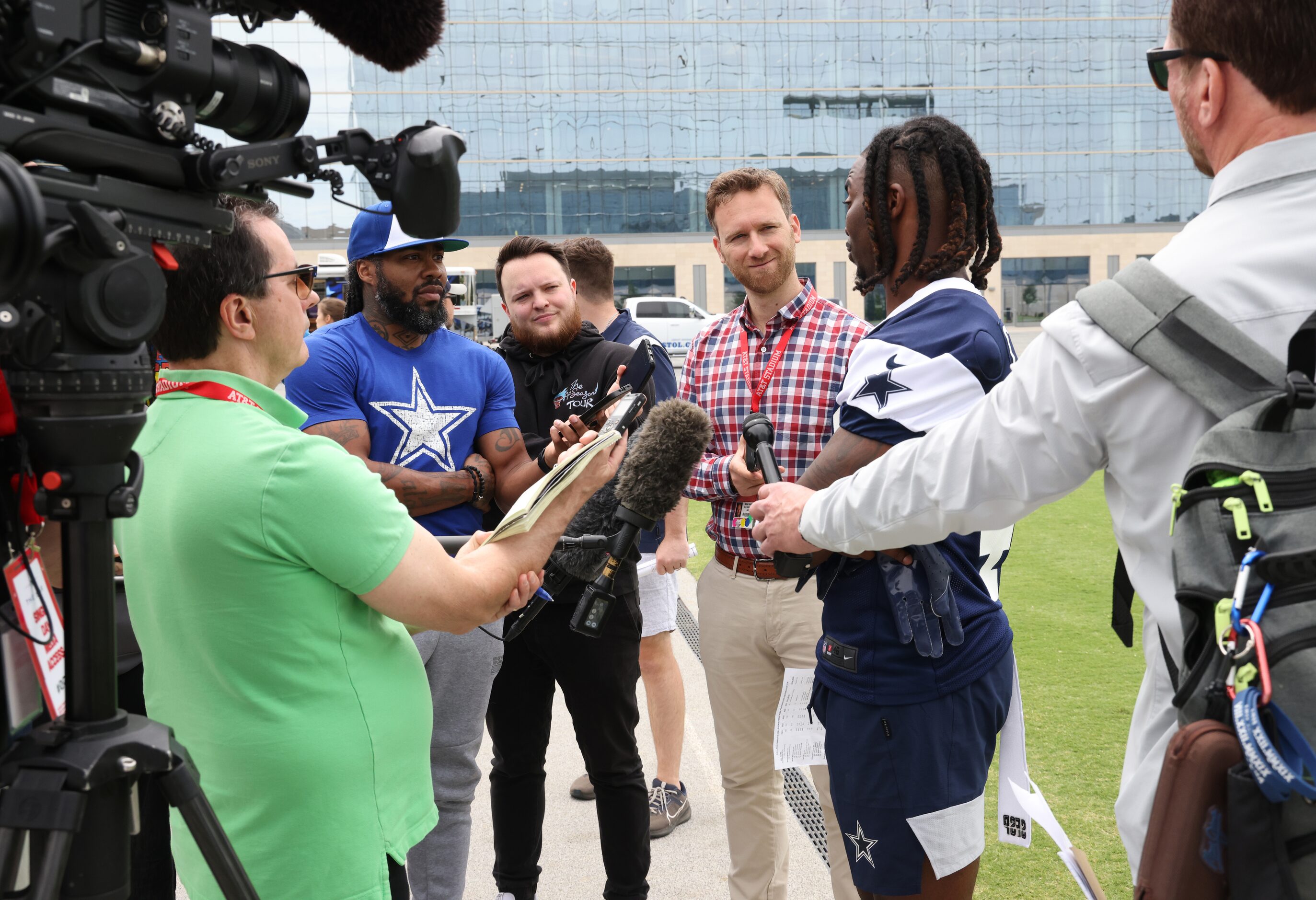 Dallas Cowboys cornerback Caelen Carson (41), center right, fields questions from media...