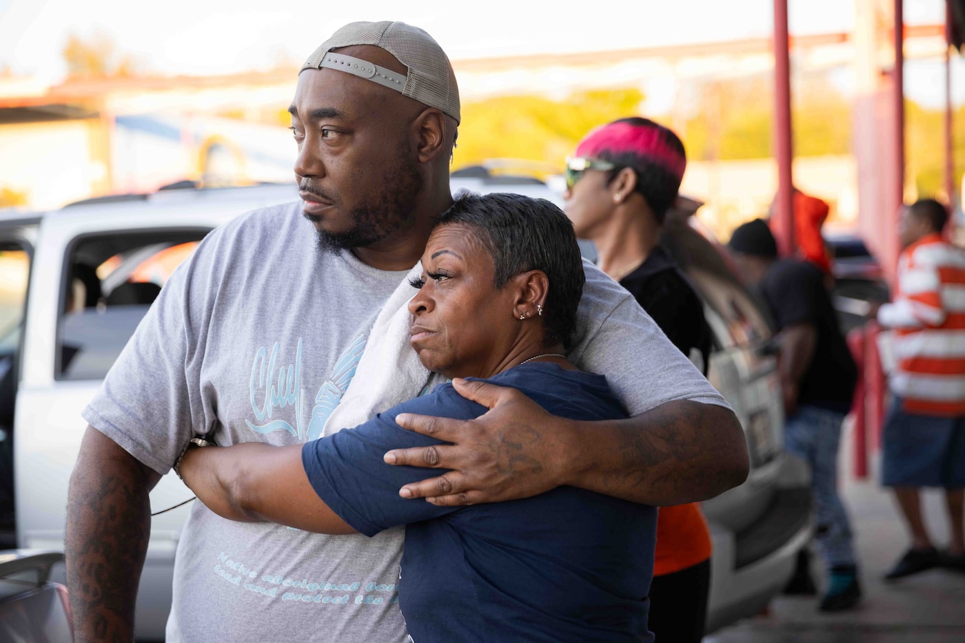 Iris Jefferson (right) hugs her nephew Matthew Wright before family and friends hold a...