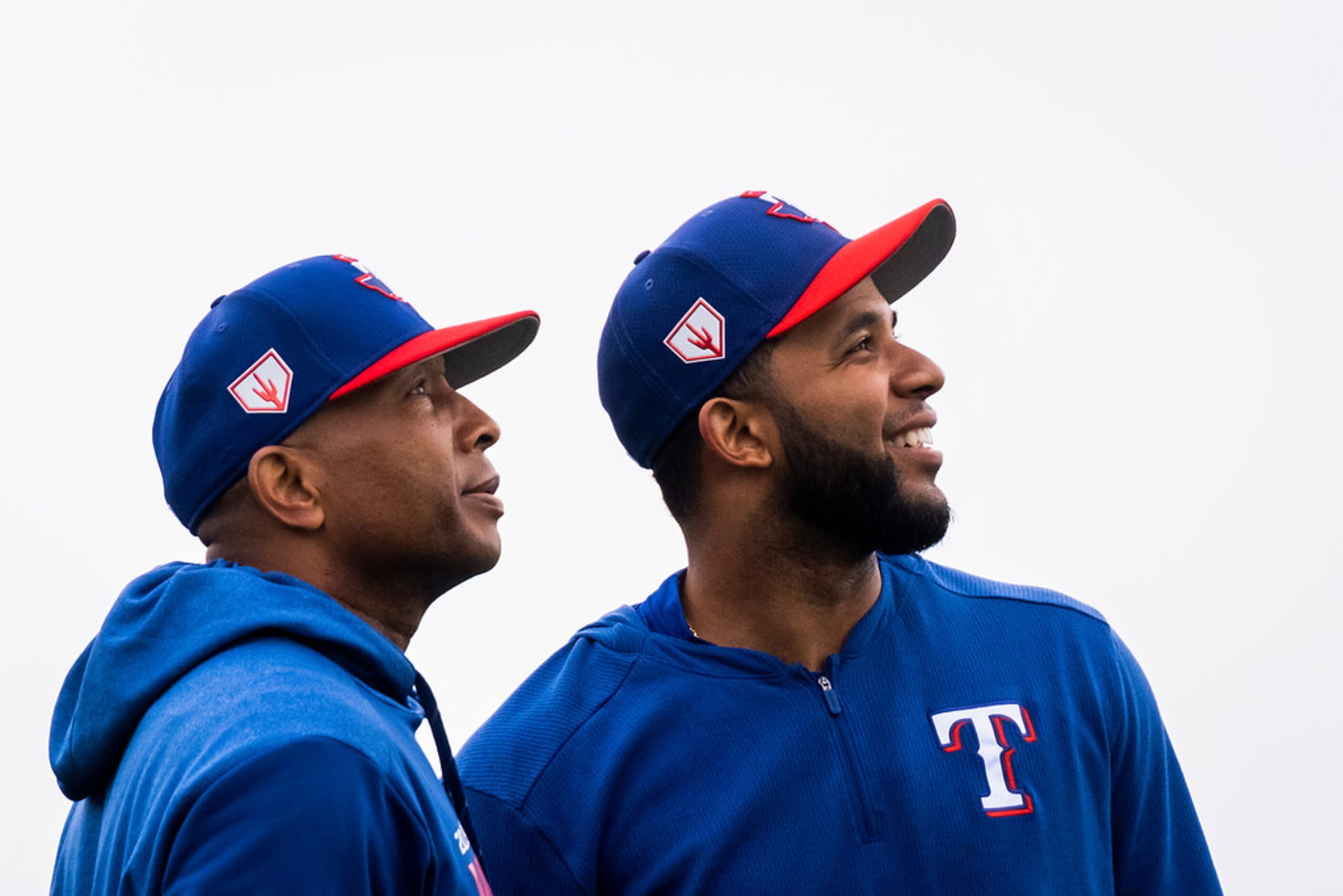 Texas Rangers shortstop Elvis Andrus (right) and third base coach Tony Beasley look to the...