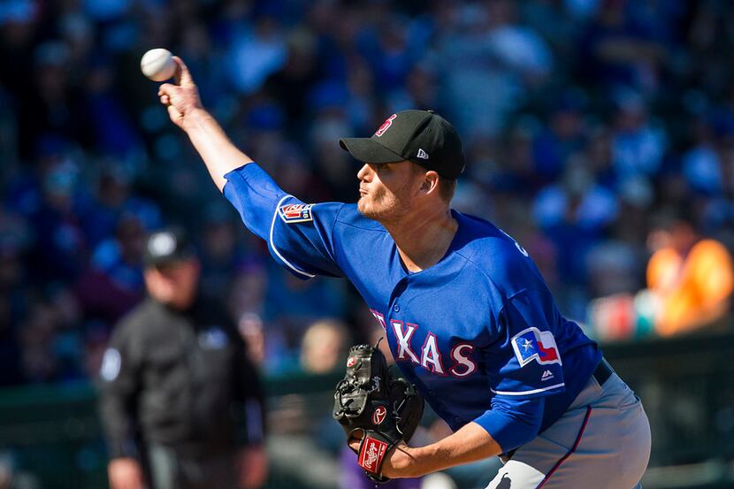 Texas Rangers pitcher Connor Sadzeck pitches during the fourth inning of a spring training...