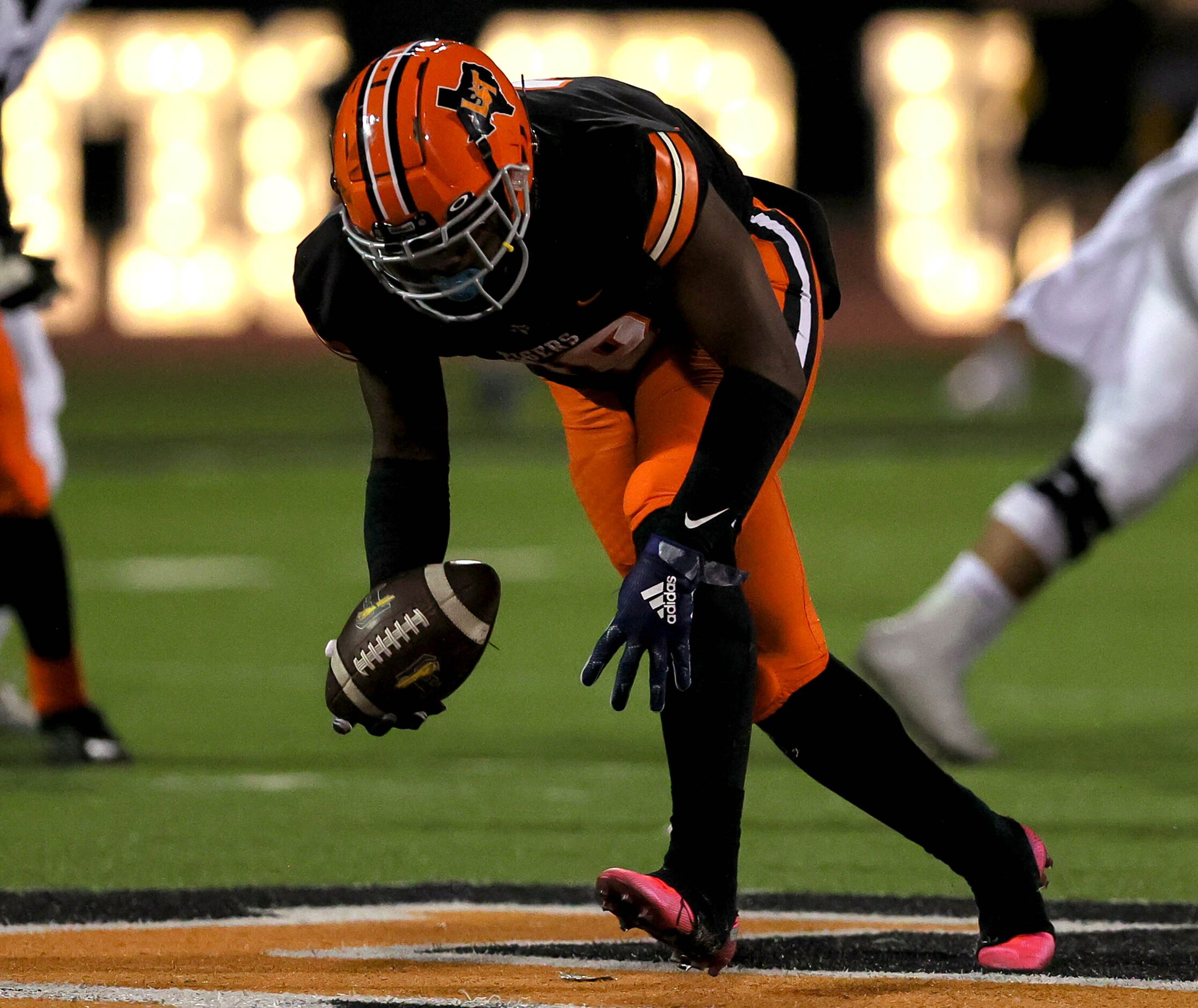 Lancaster defensive end Jamel Jones picks up a fumble and goes 55 yards for a touchdown...