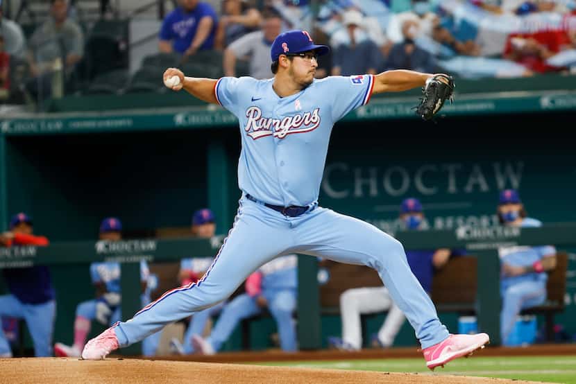 Texas Rangers starting pitcher Dane Dunning (33) pitches against the Seattle Mariners during...
