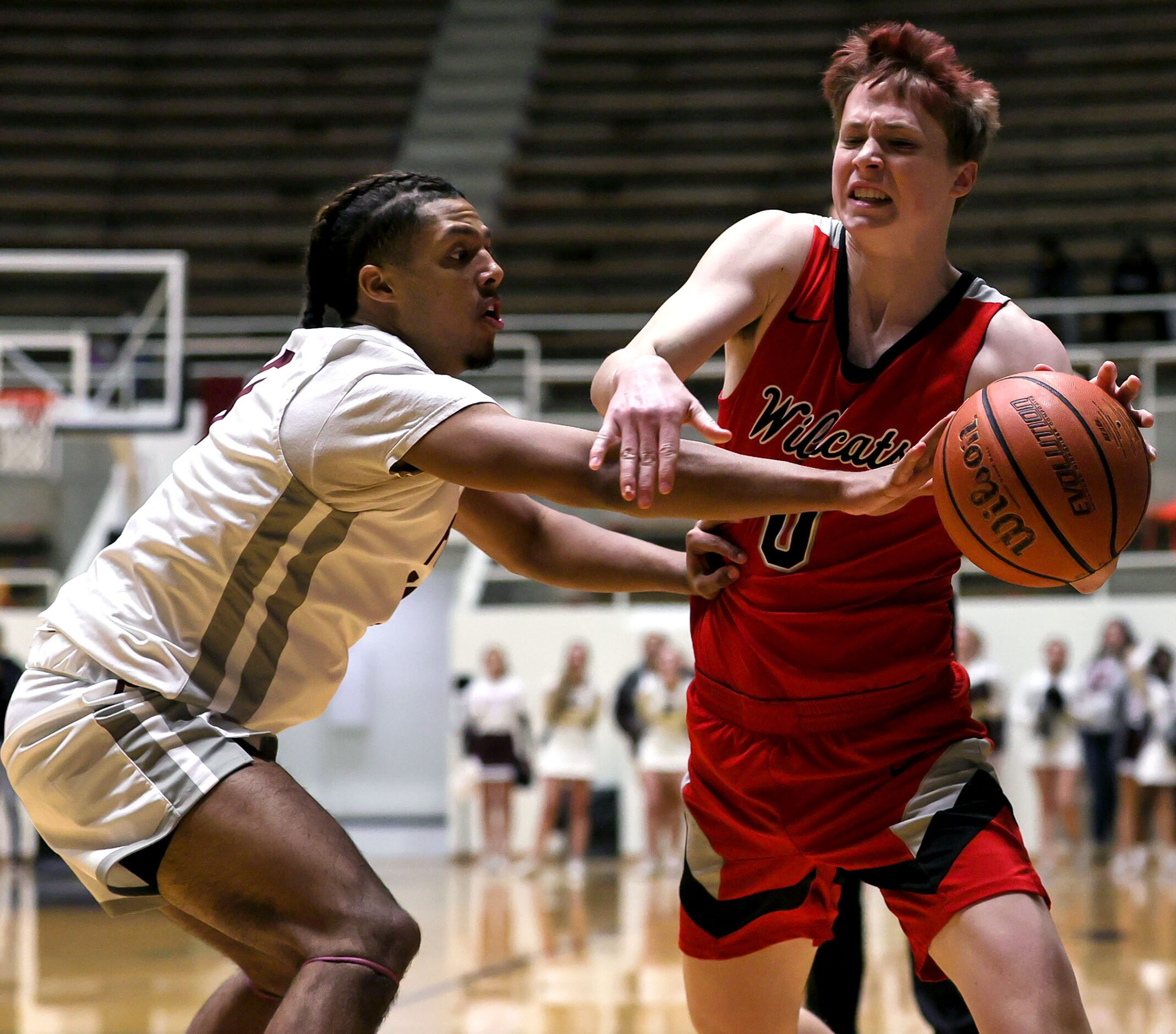 Lake Highlands guard Kyle Moran (0) gets fouled by Plano guard Xavier Williams (L) during...