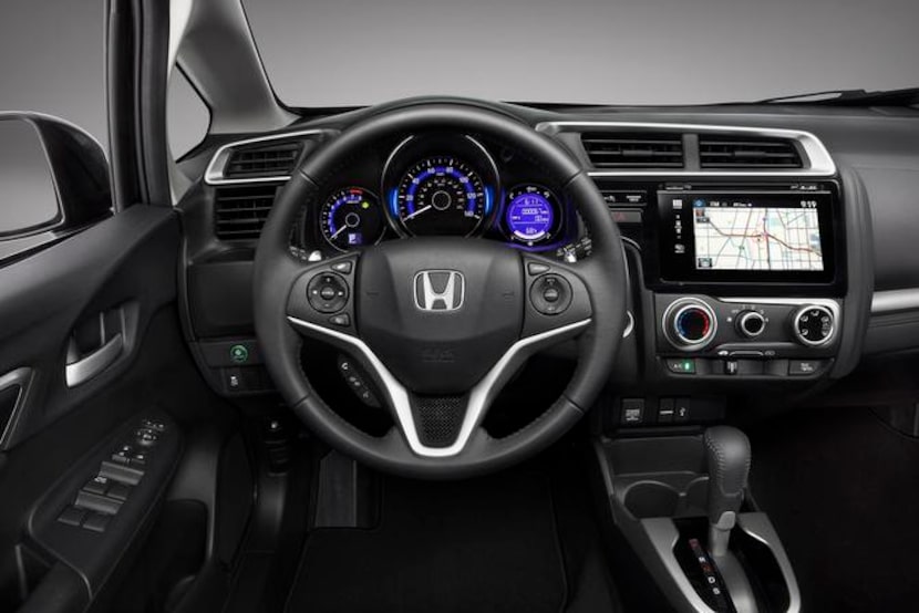 
The 2015 Honda Fit offers a fairly elegant center stack framed in plastic with a 7-inch...