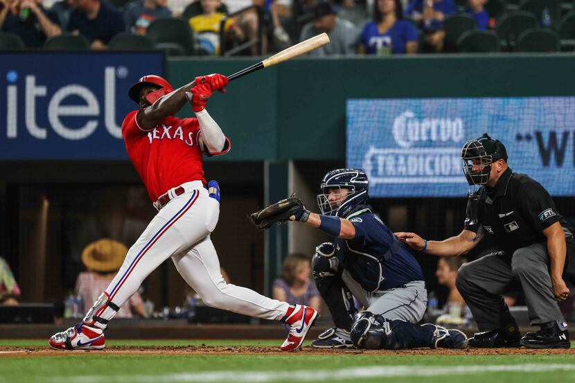 Texas Rangers Adolis Garcia (53) hits the ball against Seattle Mariners during fourth inning...