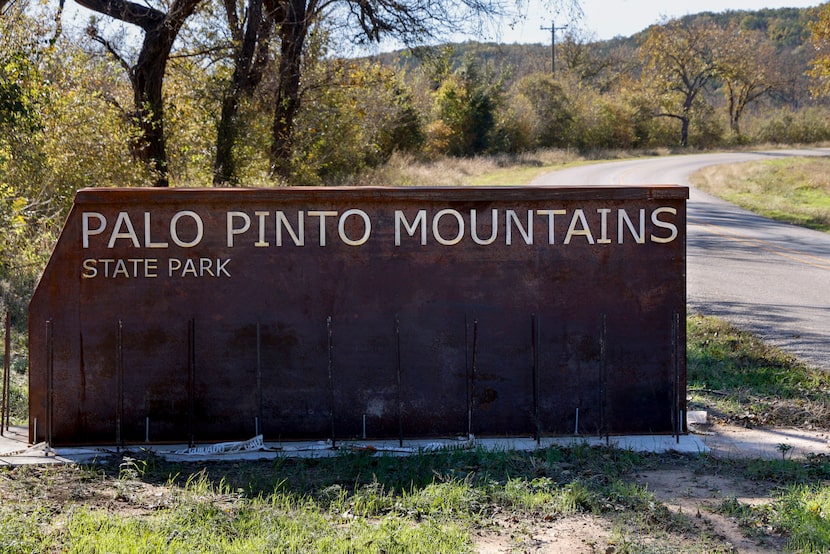 A sign for at Palo Pinto Mountains State Park is seen near the entrance, Tuesday, Nov. 19,...