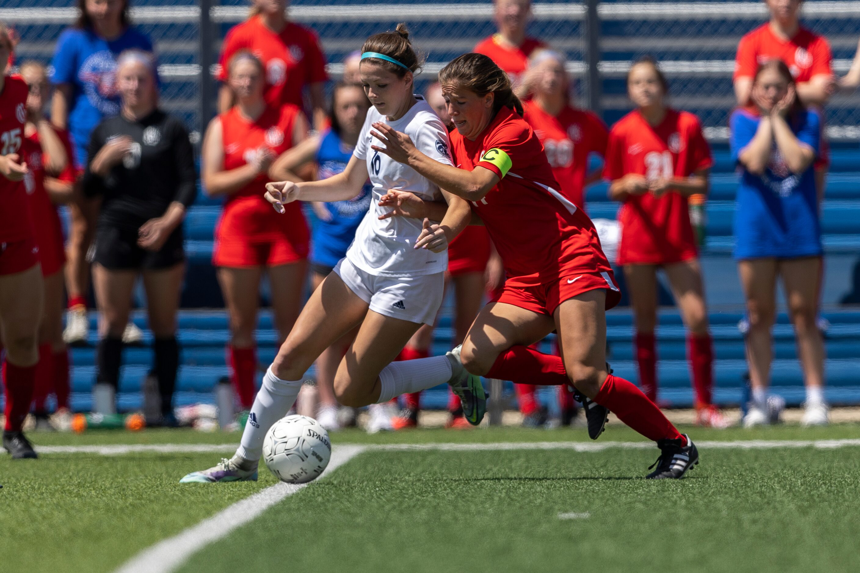 Boerne Champion midfielder Addy Huber, left, and Grapevine forward Theresa McCullough battle...