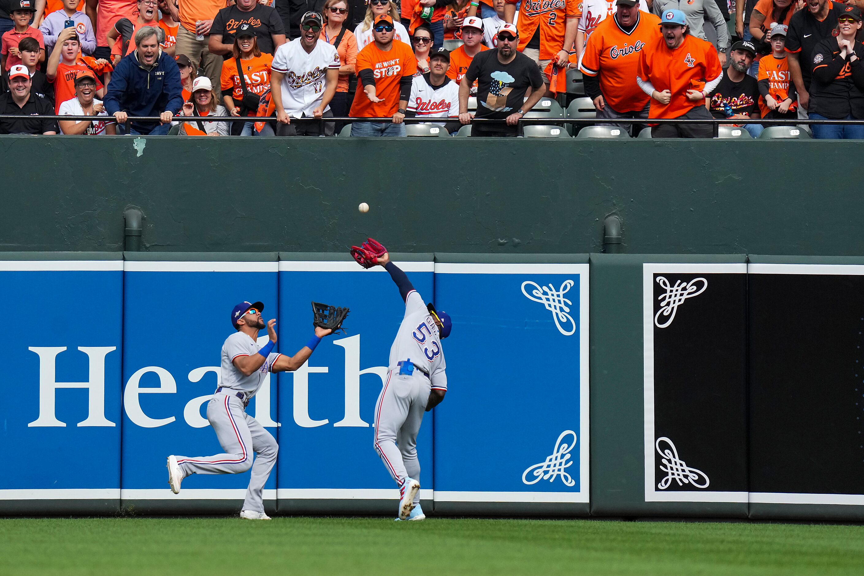 Texas Rangers right fielder Adolis Garcia (53) makes a catch on a fly ball off the bat of...