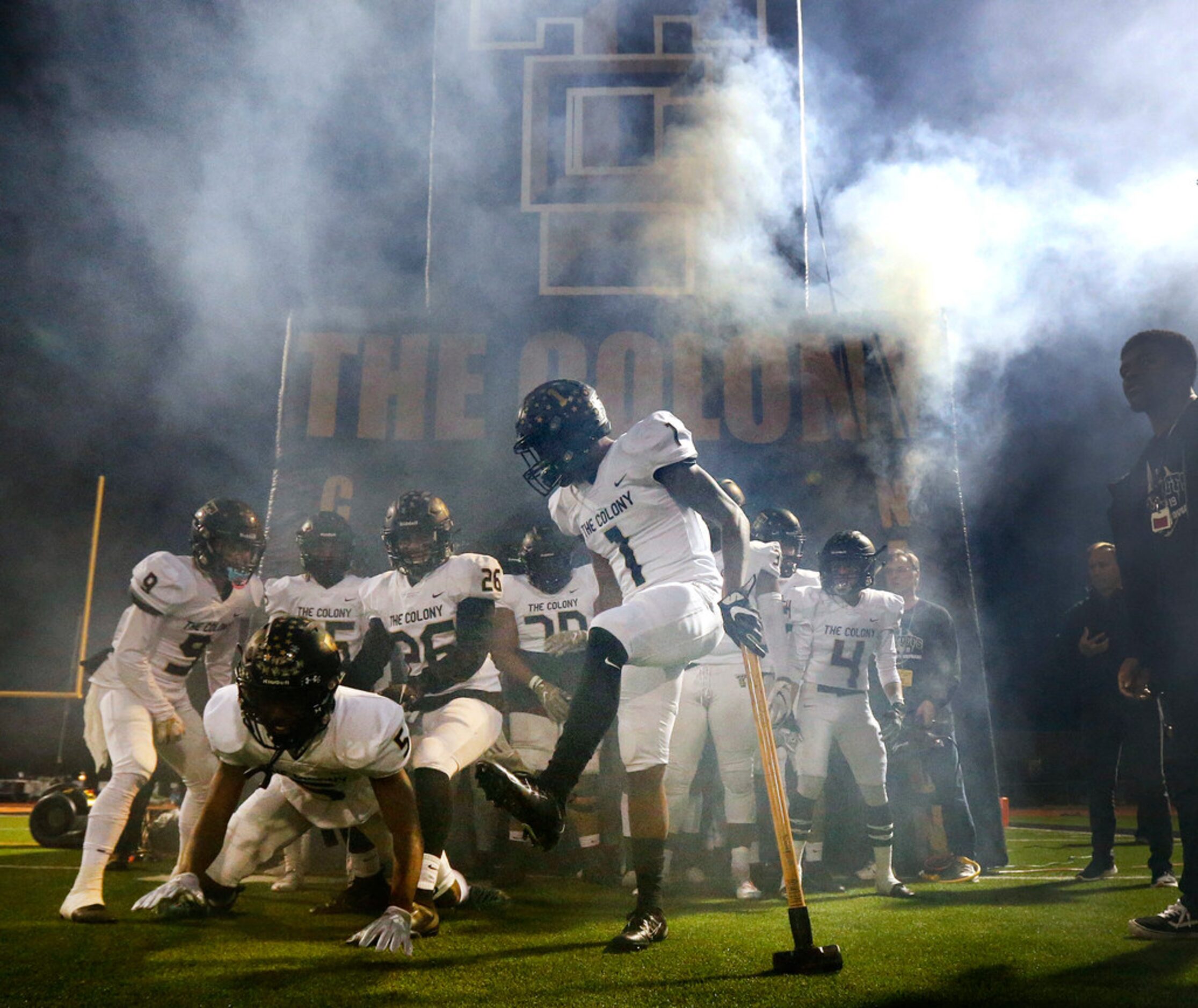 With a sledge hammer in hand, The Colony's Myles Price (1) gets teammates, including...