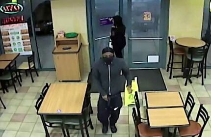 An image from security camera footage in the second of two aggravated robberies of Subway...