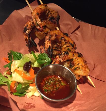 Grilled shrimp are marinated in chermoula, a north African marinade. Shrimp are served with...