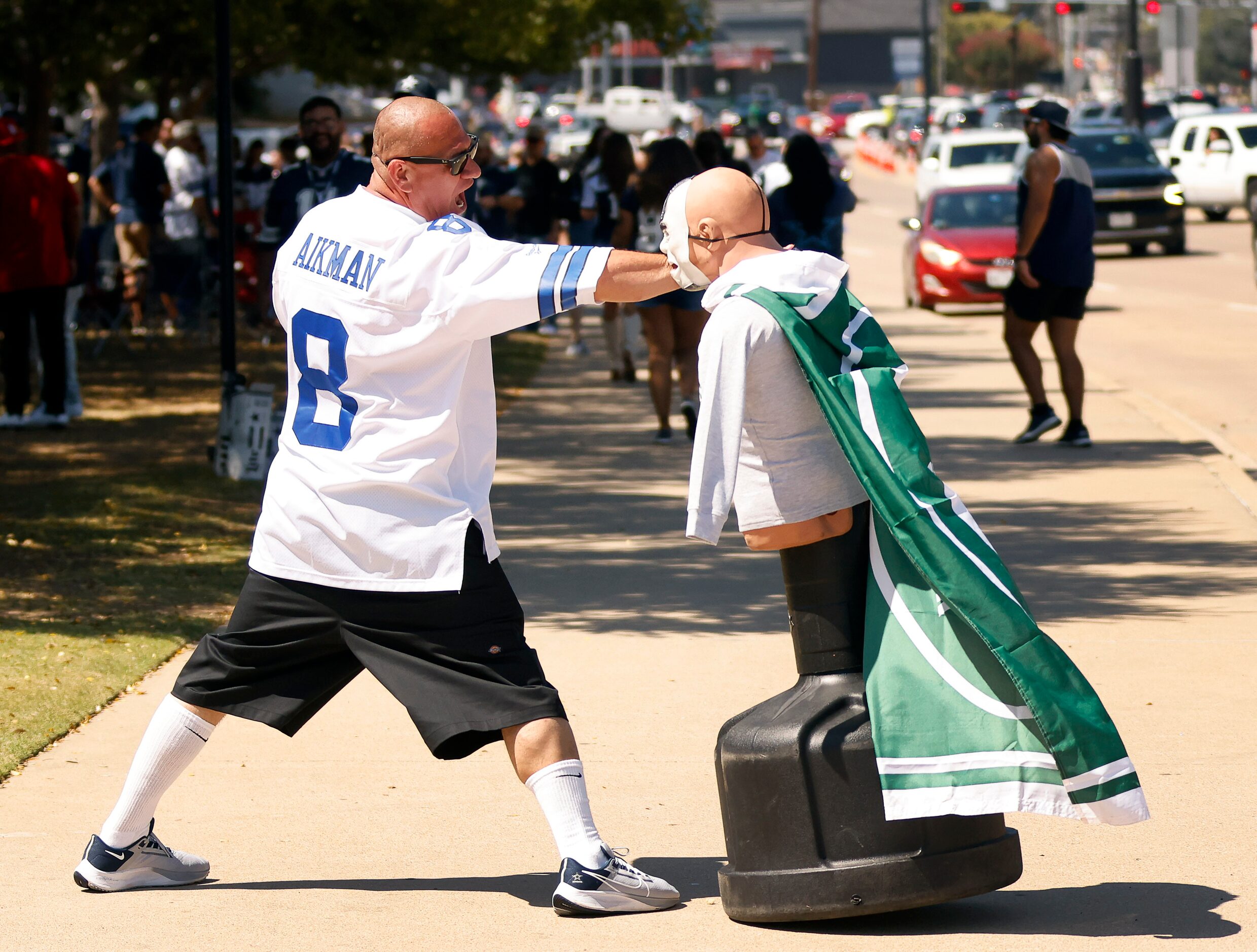 Dallas Cowboys fan Eddie Marquez of Irving levels a punch on a New York Jets-dressed martial...