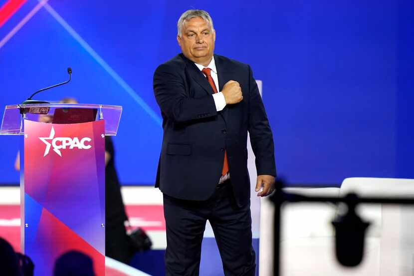 Hungarian Prime Minister Viktor Orbán gestured with his fist on his chest after speaking at...