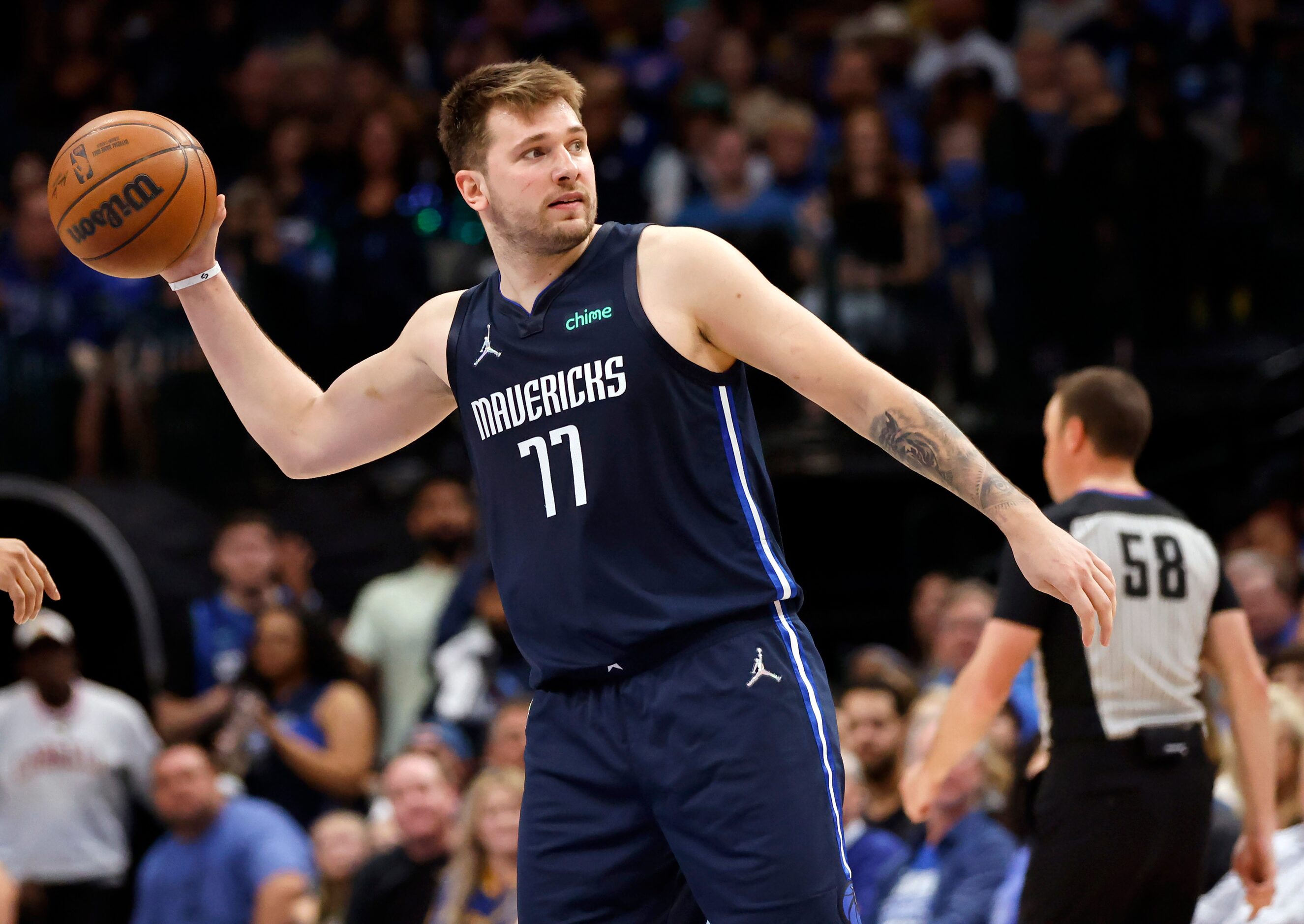 Dallas Mavericks guard Luka Doncic (77) throws the ball after the Mavs turned the ball over...