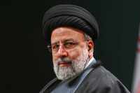 Iranian President Ebrahim Raisi listened to Turkish President Recep Tayyip Erdogan during a...
