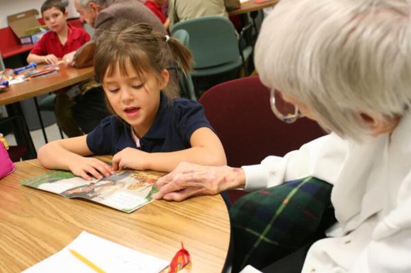 
Jesi Geier reads aloud to Frankie Sanders, an Emeritus at Farmers Branch resident. A group...