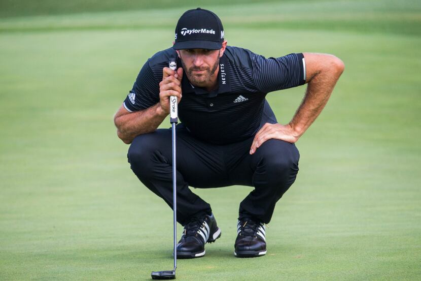 Dustin Johnson lines up a putt on the eighteenth green during round three of the AT&T Byron...