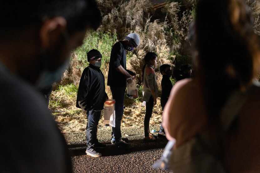 Unaccompanied immigrant minors wait to be processed by Border Patrol agents after they...