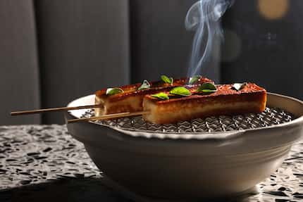 Steam rises from a serving of Grilled “Beach Cheese” On A Stick at the Meridian. It was one...
