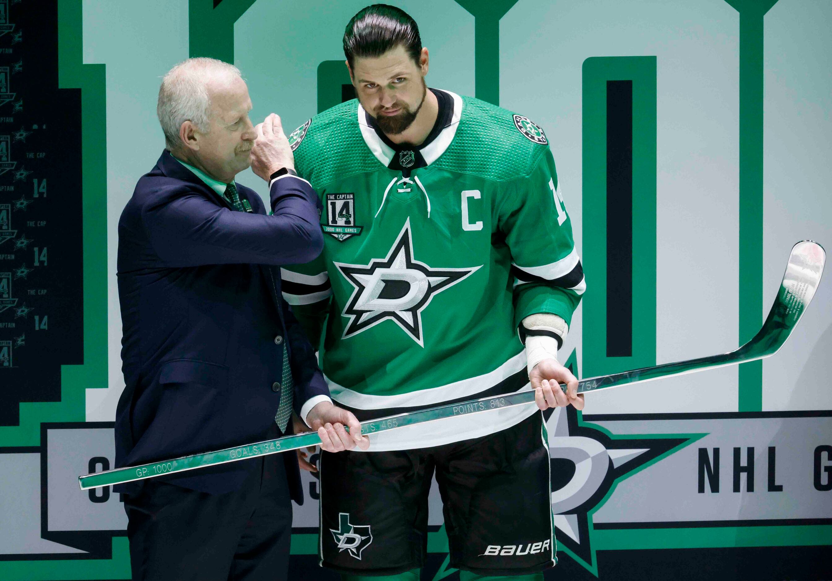 Dallas Stars left wing Jamie Benn (14) kisses his fiancee, Jessica Bennett,  during a ceremony prior to an NHL hockey game against the Colorado  Avalanche, Saturday, March 4, 2023, in Dallas. (AP