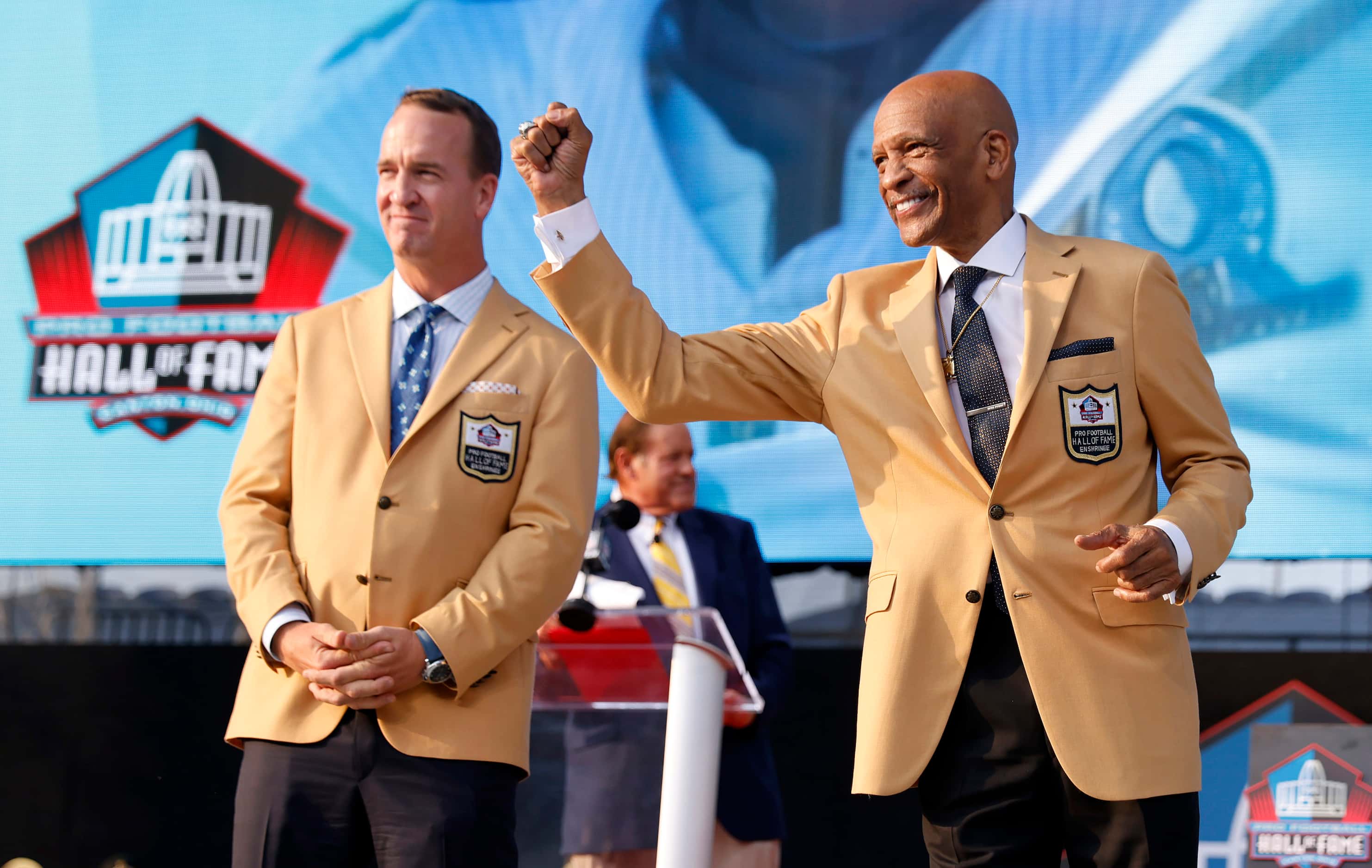 Pro Football Hall of Fame inductee Drew Pearson of the Dallas Cowboys pumps his fist to his...