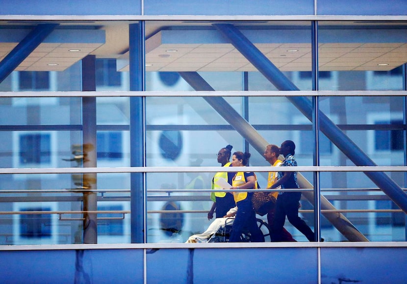 
Nedra Washington, 28, of Dallas was the first inpatient to be wheeled across the sky bridge...