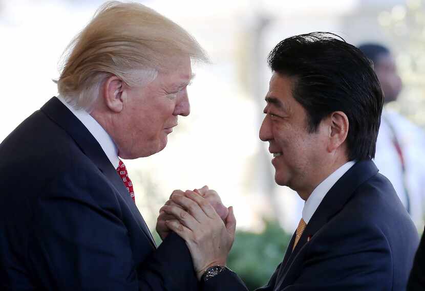 WASHINGTON, DC - FEBRUARY 10:  President Donald Trump (L) greets Japanese Prime Minister...