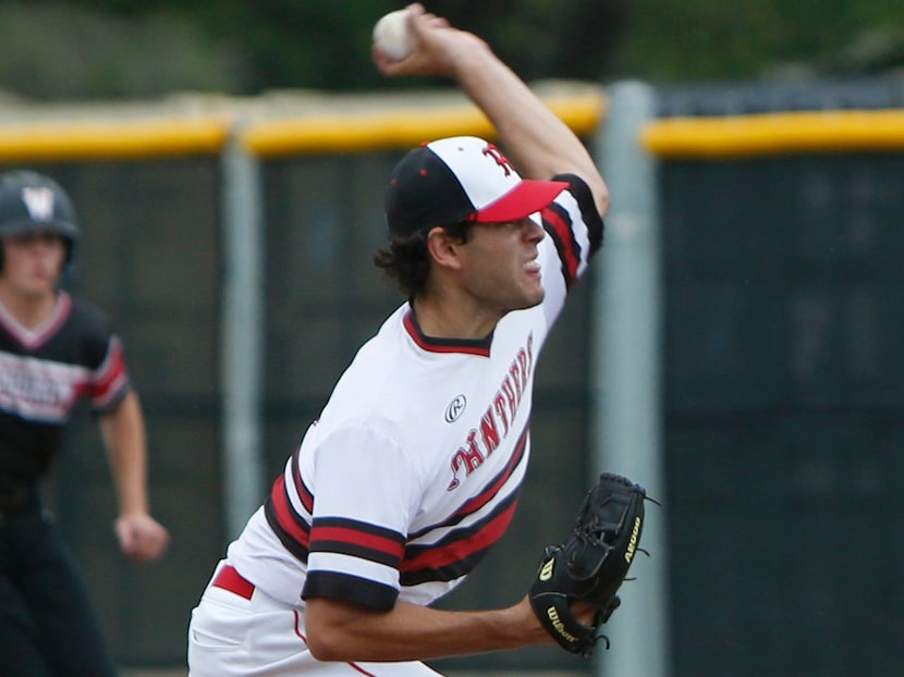 Hillcrest pitcher Ryan Prager (10) delivers a pitch with a Woodrow Wilson pitcher on base...