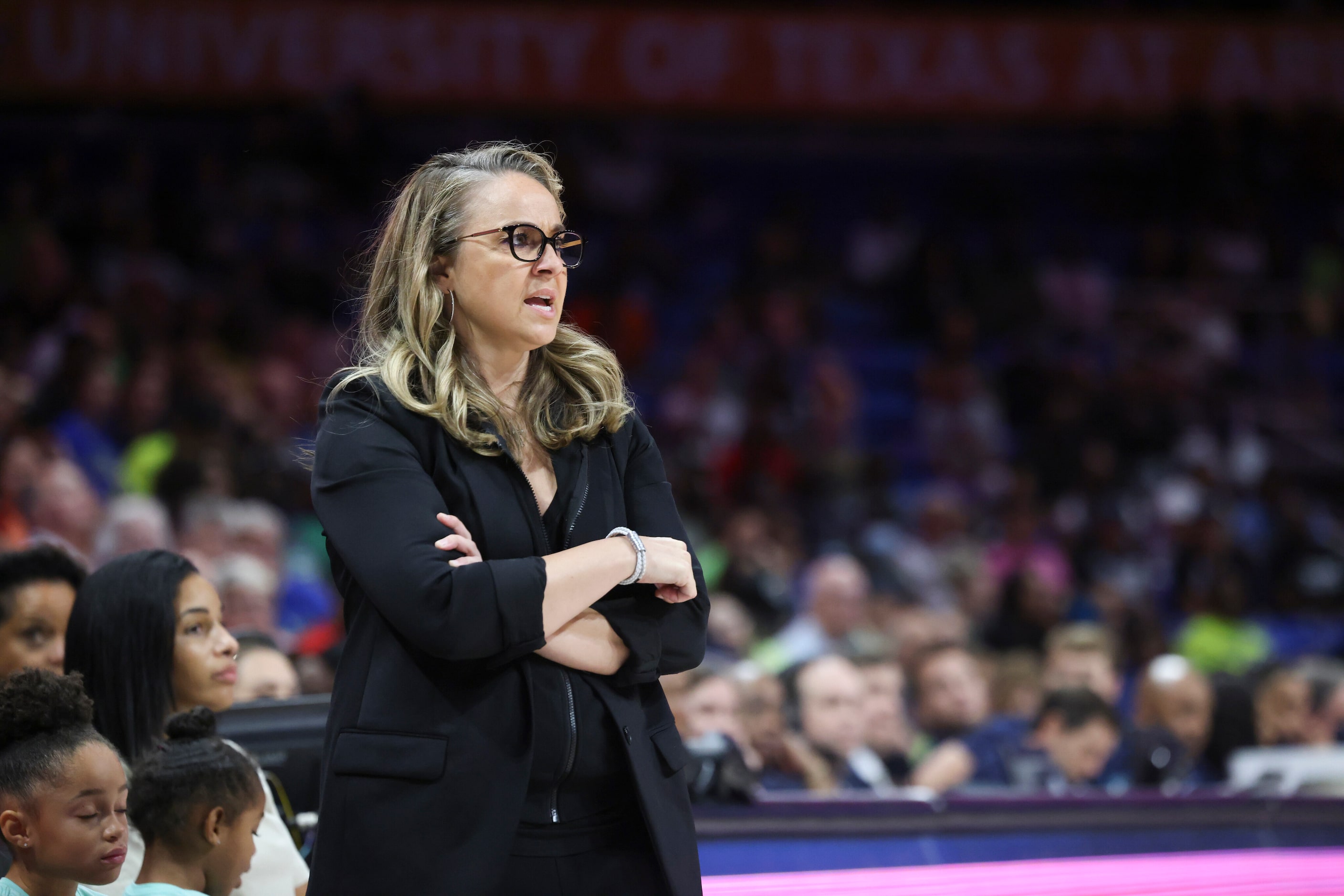 Becky Hammon, Las Vegas Aces Head Coach, watches the  game against Dallas Wings Thursday,...