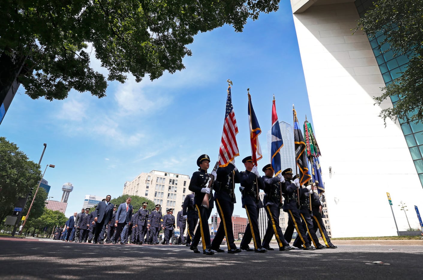 A Dallas Police Honor Guard marched Wednesday during a service commemorating fallen police...