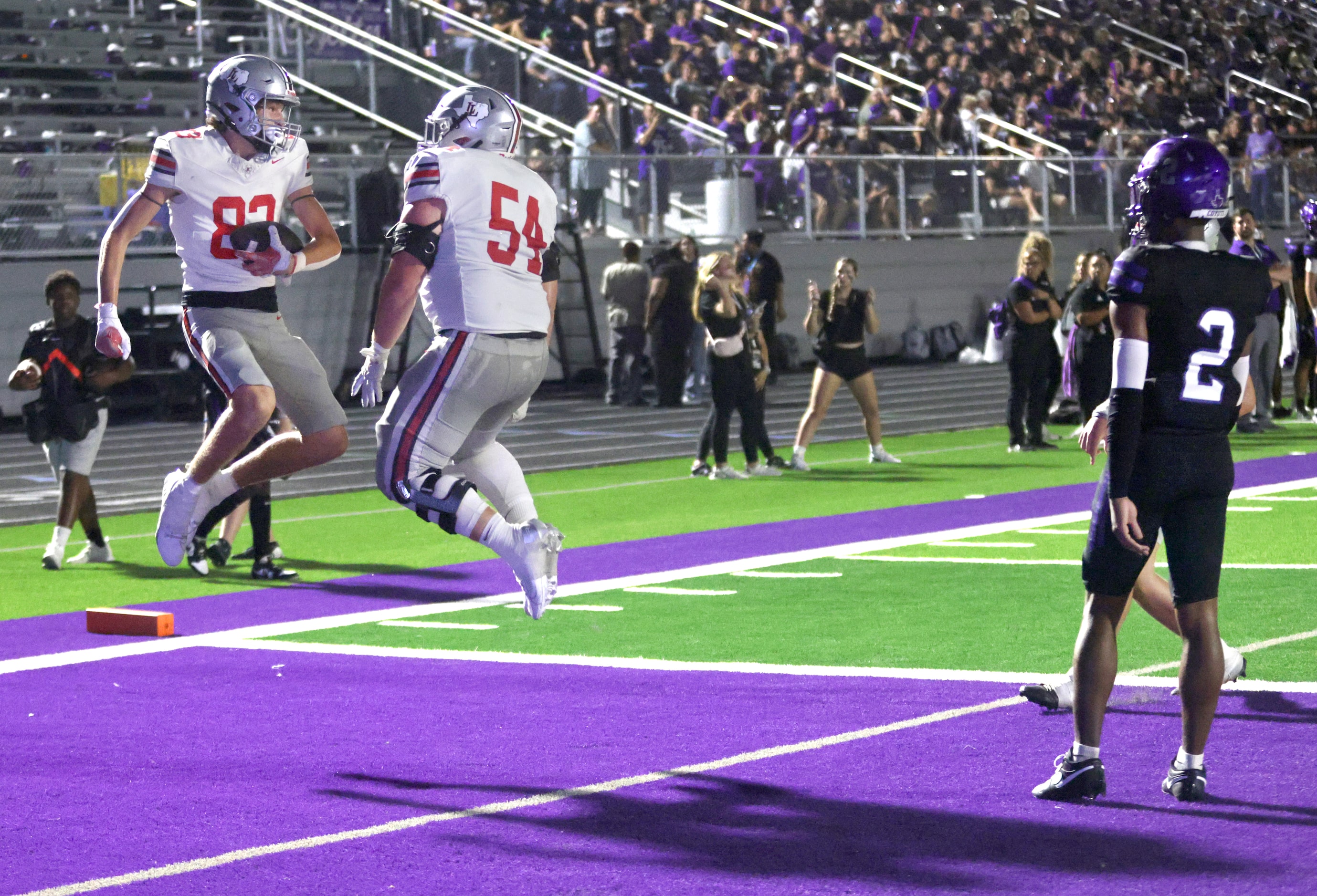 Lovejoy players #83 Coleman Reaugh and #54 Braeden Gibson celebrate after a touchdown during...