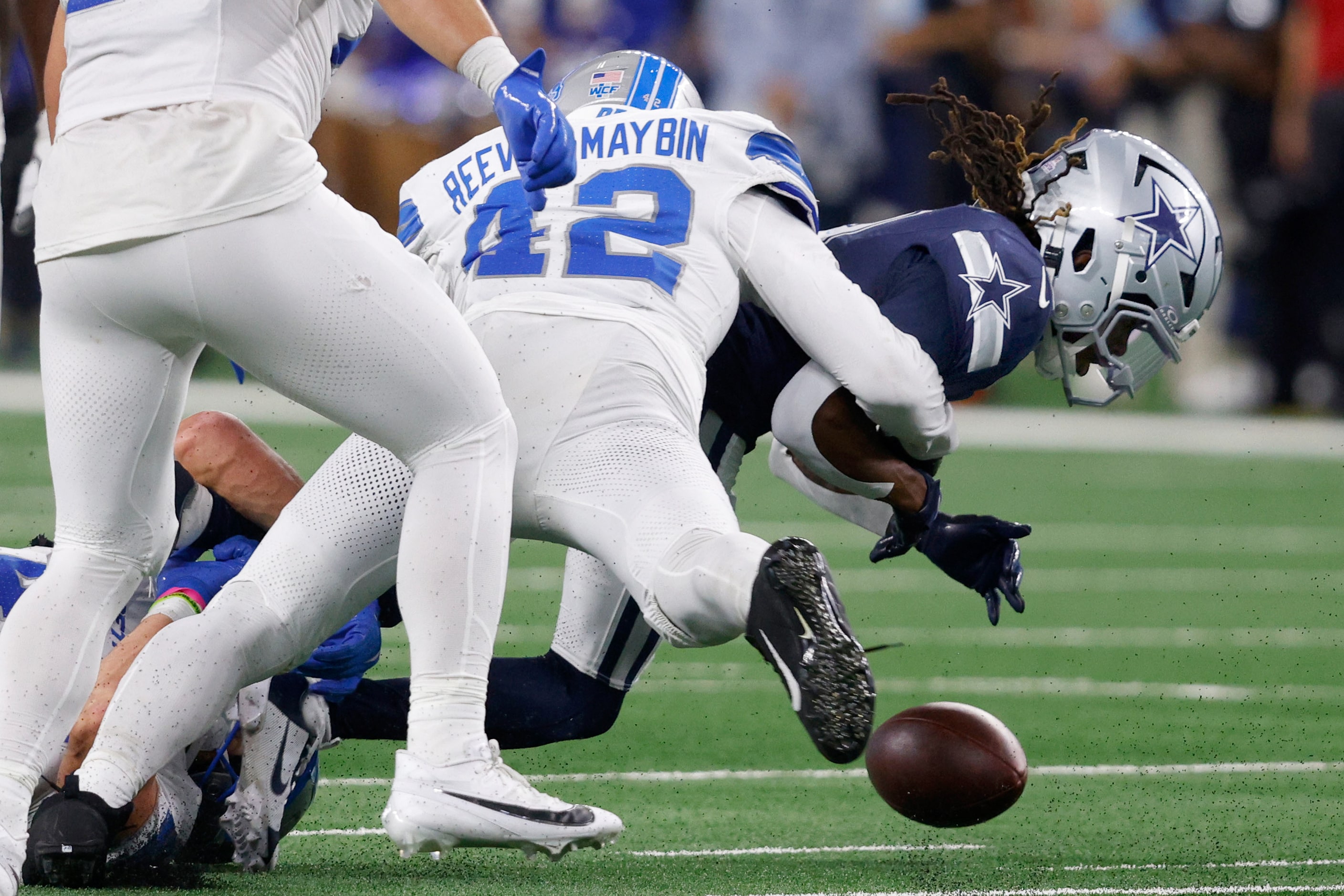 Dallas Cowboys wide receiver KaVontae Turpin (9) fumbles the ball as Detroit Lions...