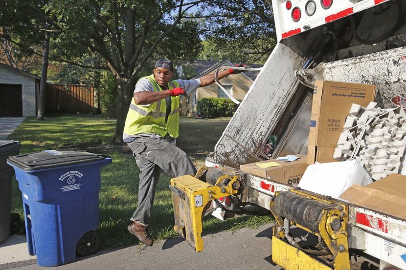  Dallas sanitation worker Markeese Griggs makes $7.50 an hour via a staffing contract with...