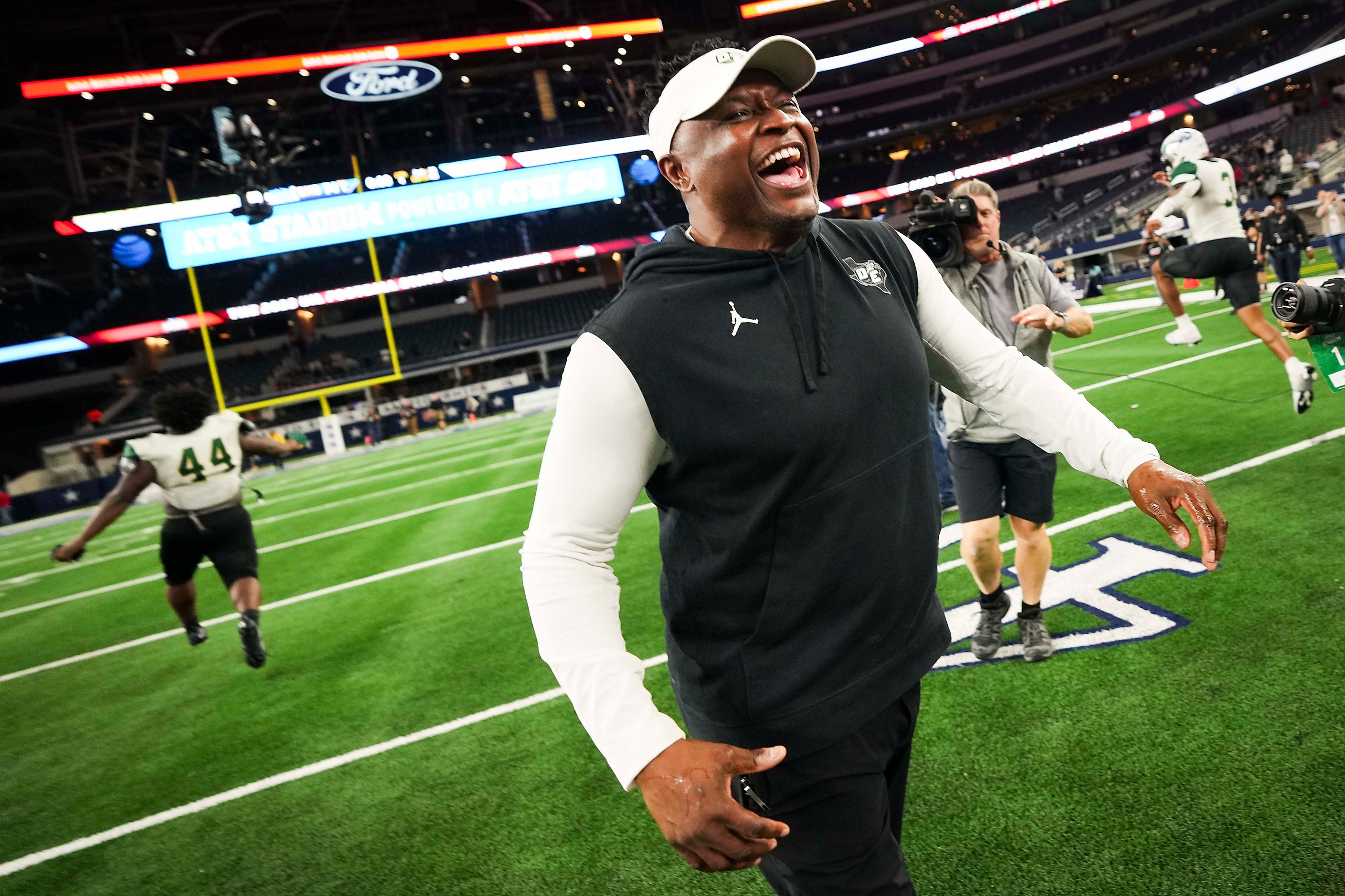 DeSoto head coach Claude Mathis hugs celebrates after a victory over Humble Summer Creek in...