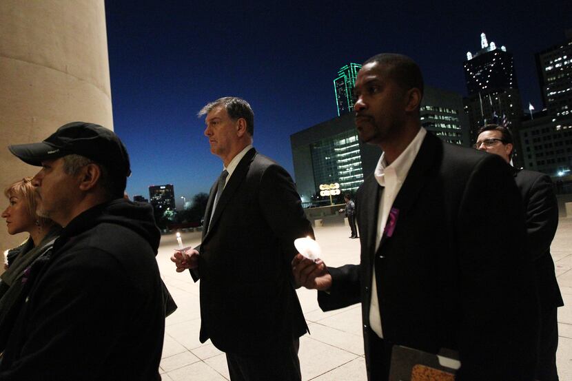 Mayor Mike Rawlings spoke at a candlelight vigil at City Hall in January.