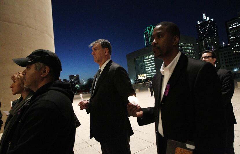 Mayor Mike Rawlings spoke at a candlelight vigil at City Hall in January.