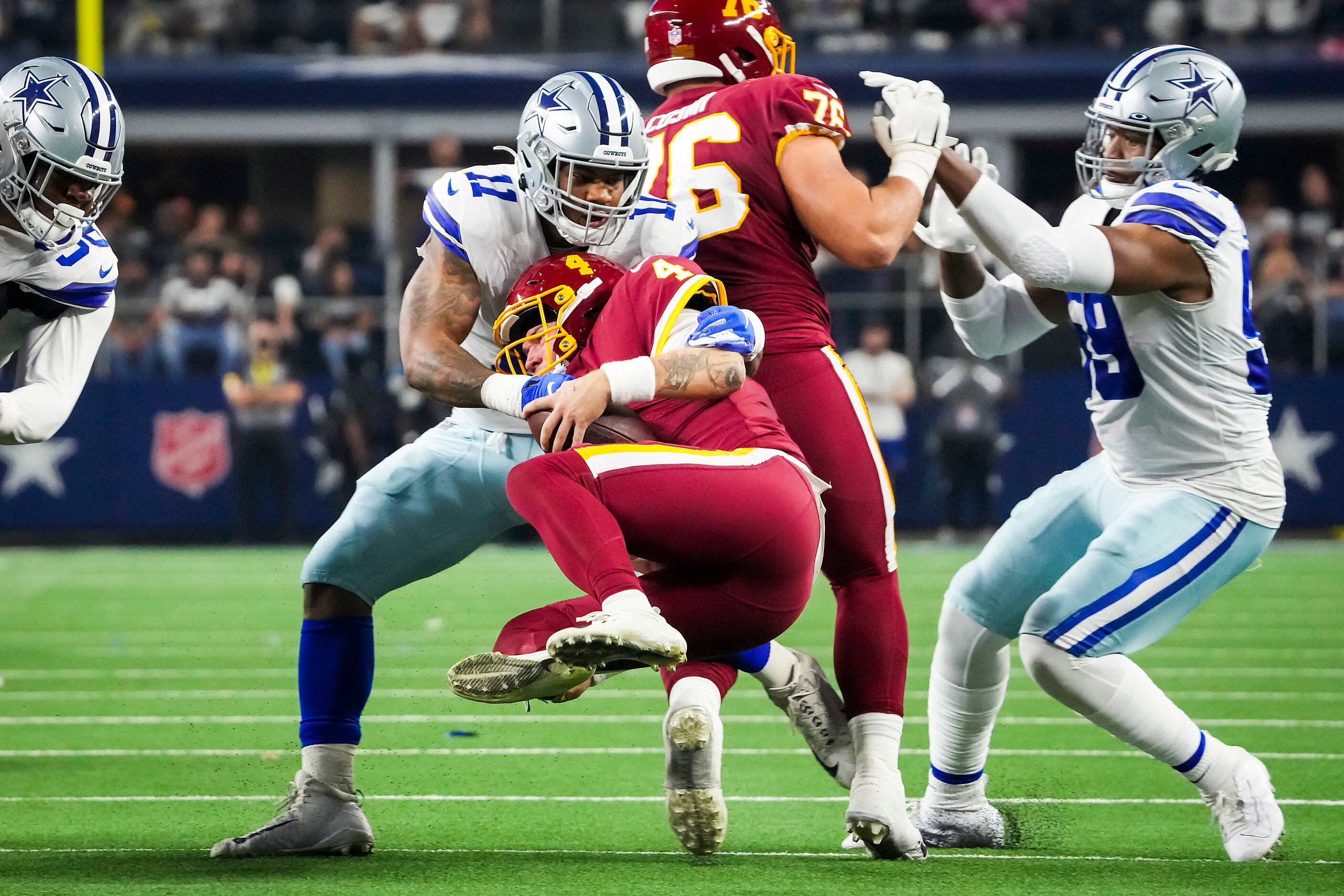 Dallas Cowboys linebacker Micah Parsons (11) watches from the bench during  the second half of an