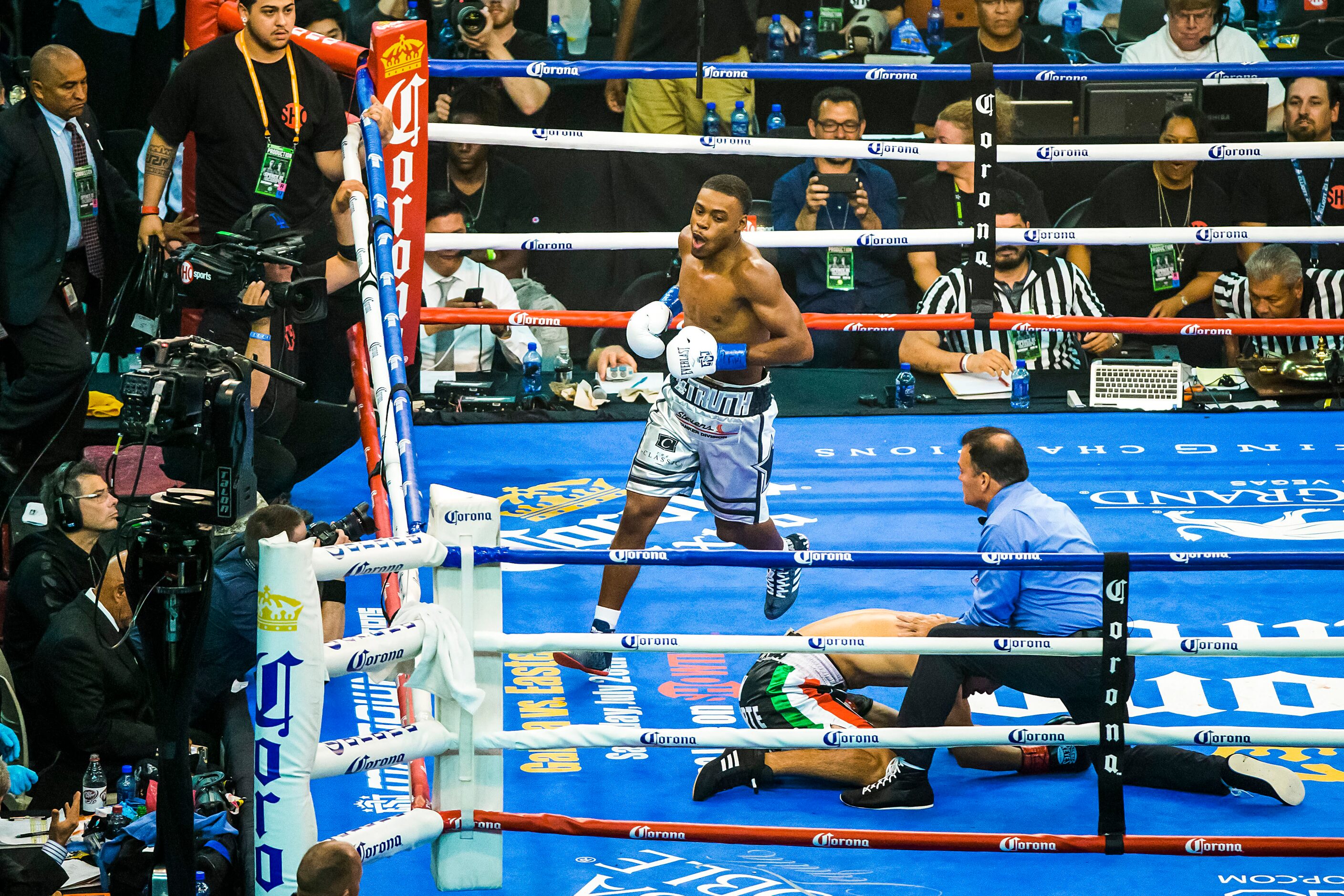 Welterweight champion Errol Spence Jr. celebrates after defending his IBF world title with a...