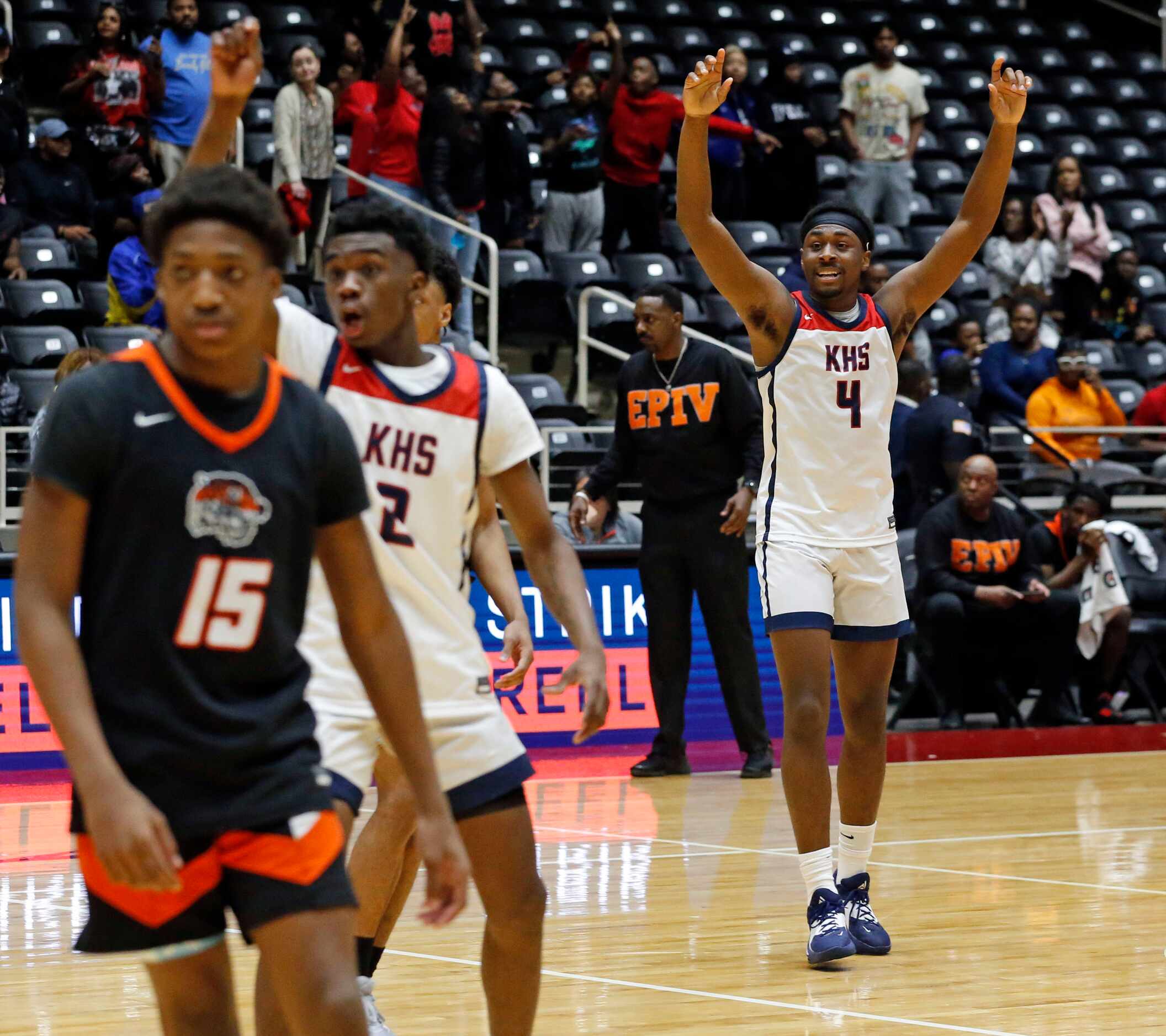 Kimball High’s T’Johnn Brown (2) and Kimball High’s DaCannon Wickware (4) celebrate, as the...