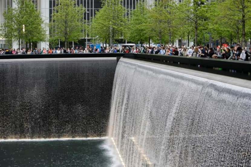 This 2014 photo shows patrons visiting the pools at The 9/11 Memorial near the World Trade...