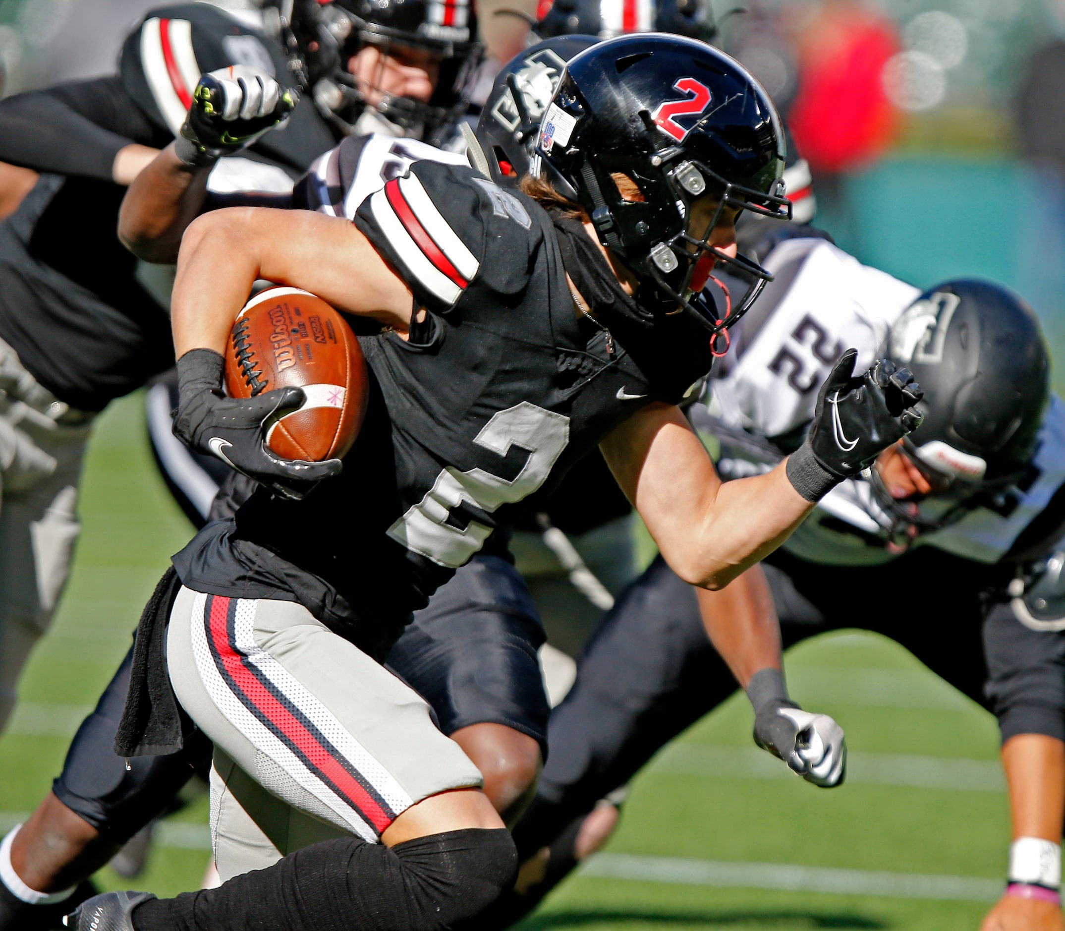 Lovejoy High School wide receiver Jaxson Lavender (2) returns a kickoff in the first quarter...