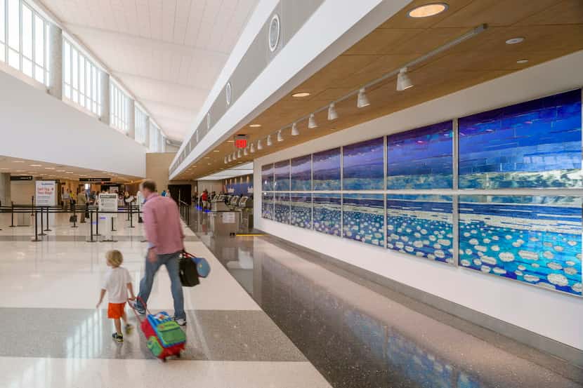  Libbie J. Masterson's "Ethereal Sky" adorns a wall next to the Southwest Airlines ticket...
