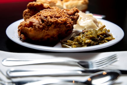 The three-piece fried chicken plate with yeast rolls, mashed potatoes, and green beans at...