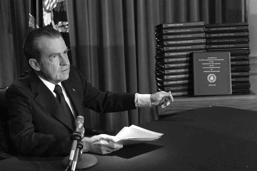 In this April 29, 1974, file photo, President Richard M. Nixon points to the transcripts of...
